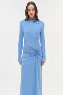 Light blue jersey midi dress with long sleeves, draped bodice, and ruched side detailing.