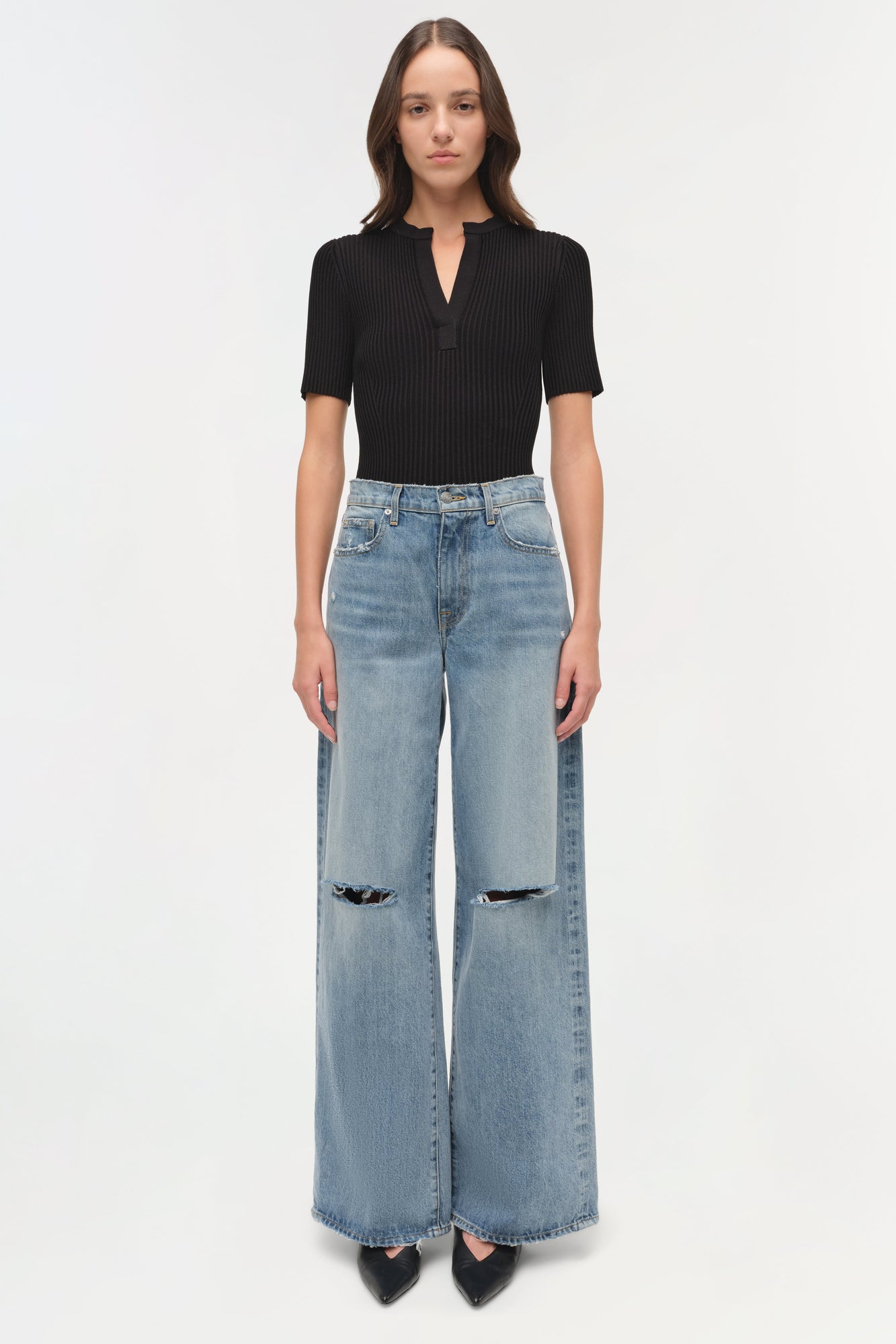 Light wash straight-leg denim crop pants with ripped knee details and cropped hem.
