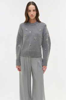 Gray crewneck knit sweater with scattered silver crystal embellishments and ribbed trim.
