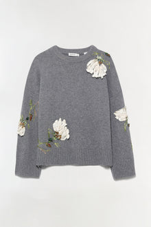 Gray knit sweater with white embroidered flowers and green stems scattered across chest and sleeves.