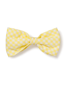 The Dog Twill Bow Tie in Yellow Gingham by Petite Plume is a cheerful checkered dog accessory, perfect for a festive look.