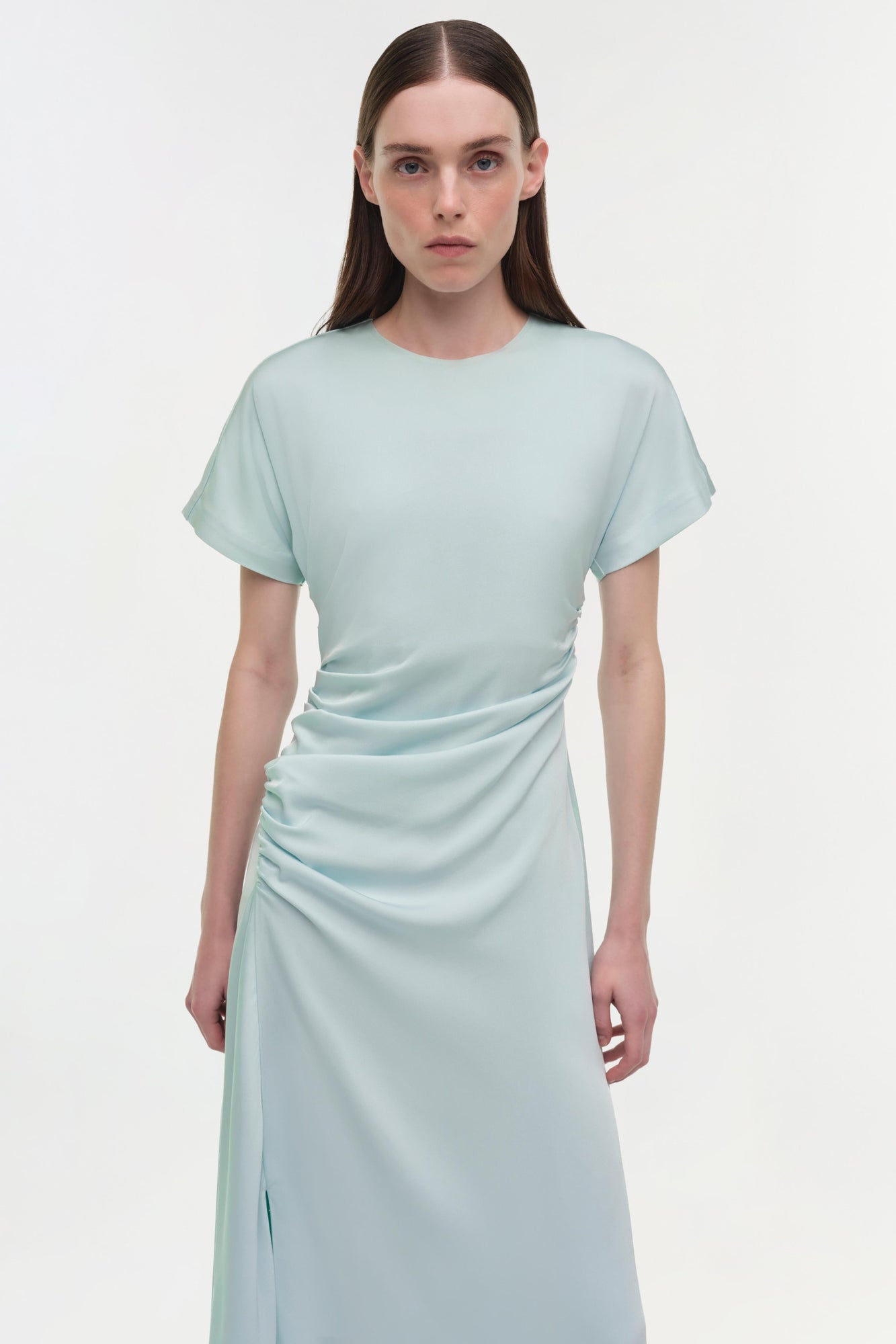 Light blue satin midi dress with short sleeves, ruched side detail, and front slit on model.