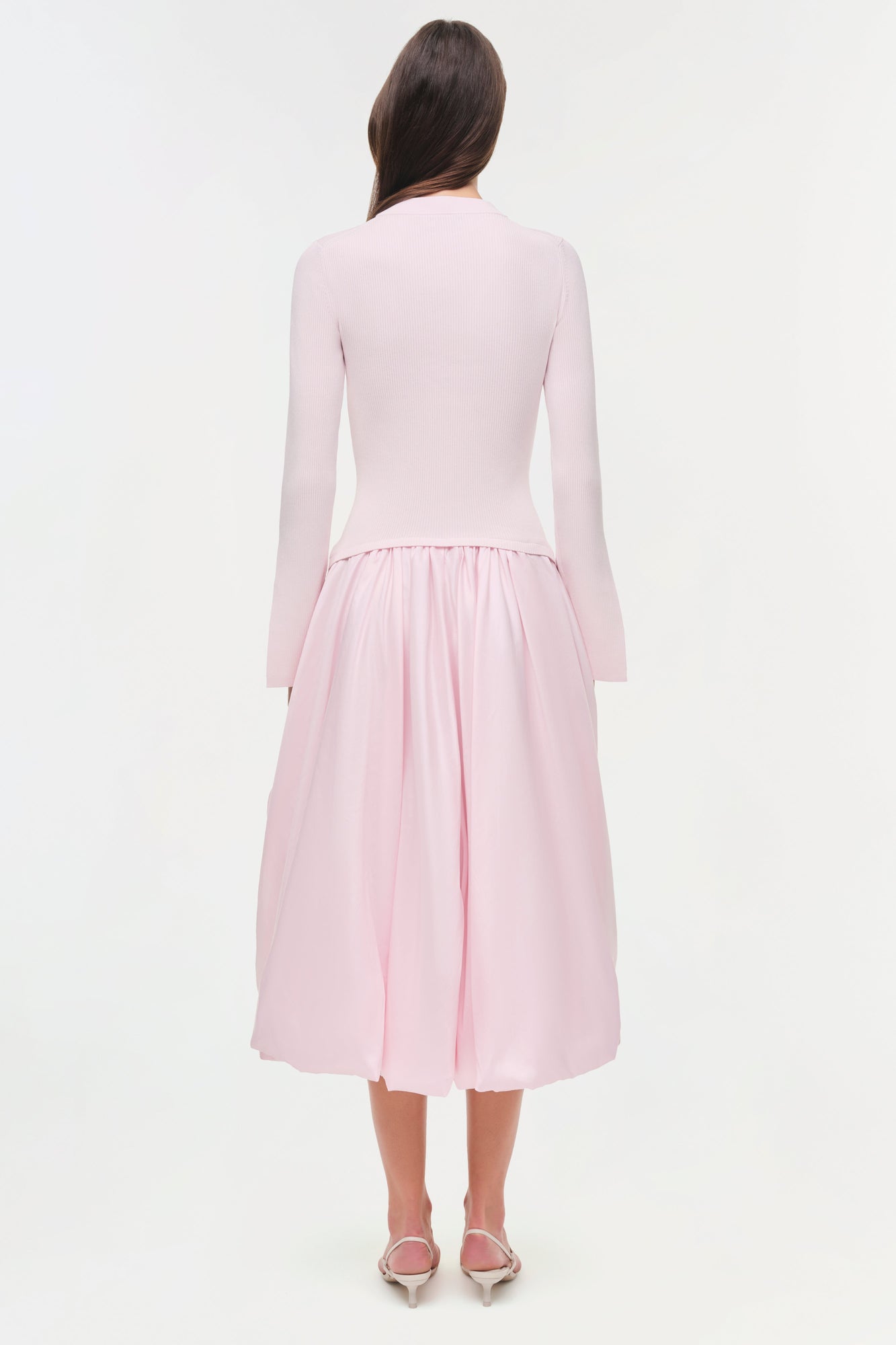 Pink midi dress with ribbed knit top and pleated taffeta skirt, shown from back.