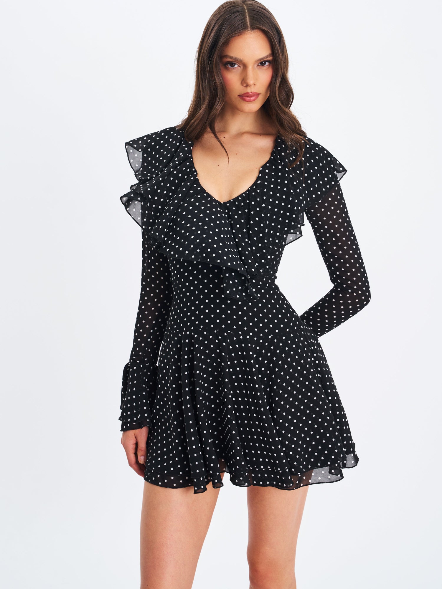 Omari Chiffon Polka Dot Ruffled Neckline Mini Dress | Black