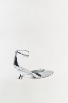Silver metallic leather wedge heel with pointed toe and ankle strap buckle closure.