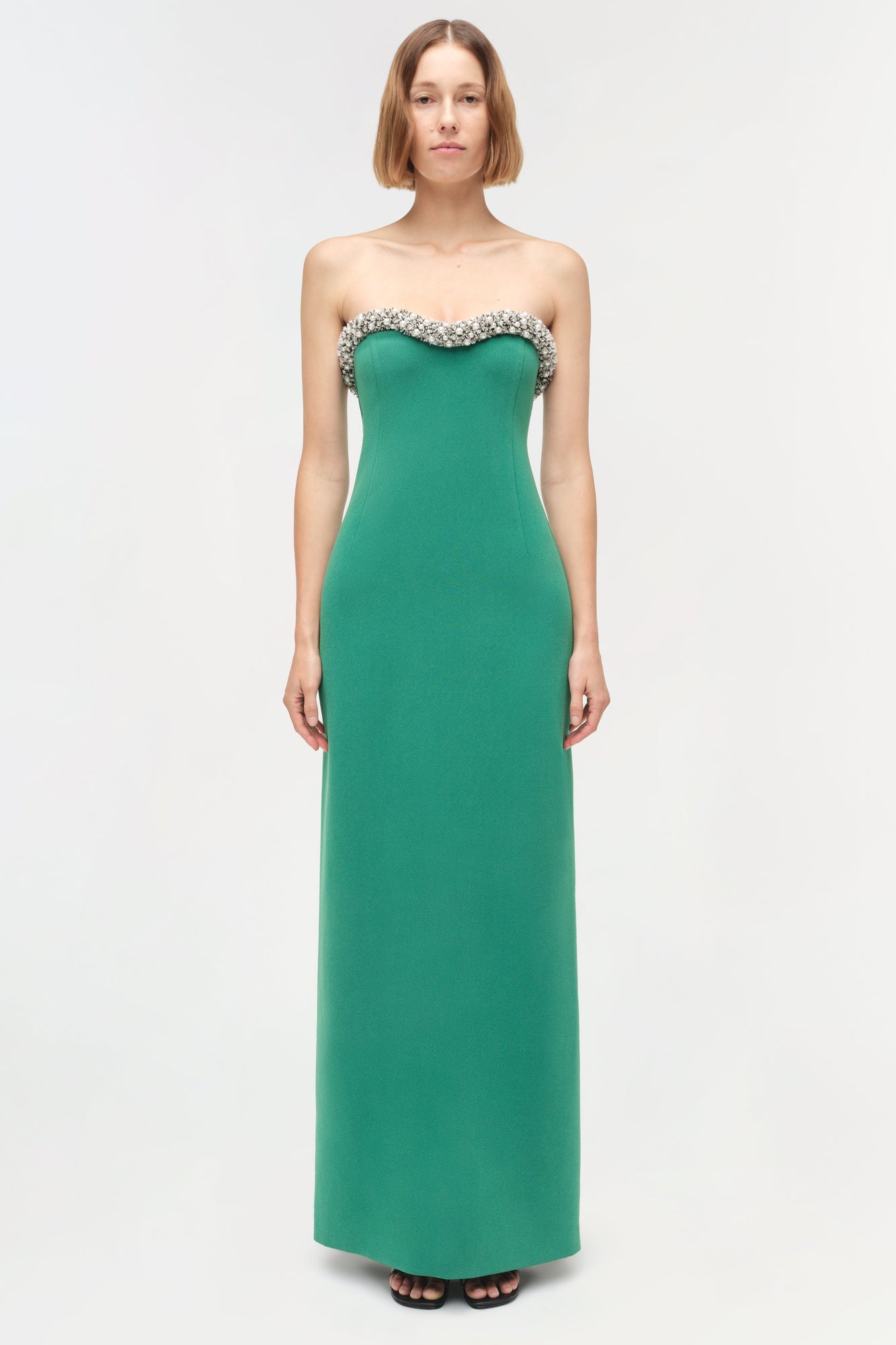 Green strapless floor-length gown with crystal embellishments along the sweetheart neckline.