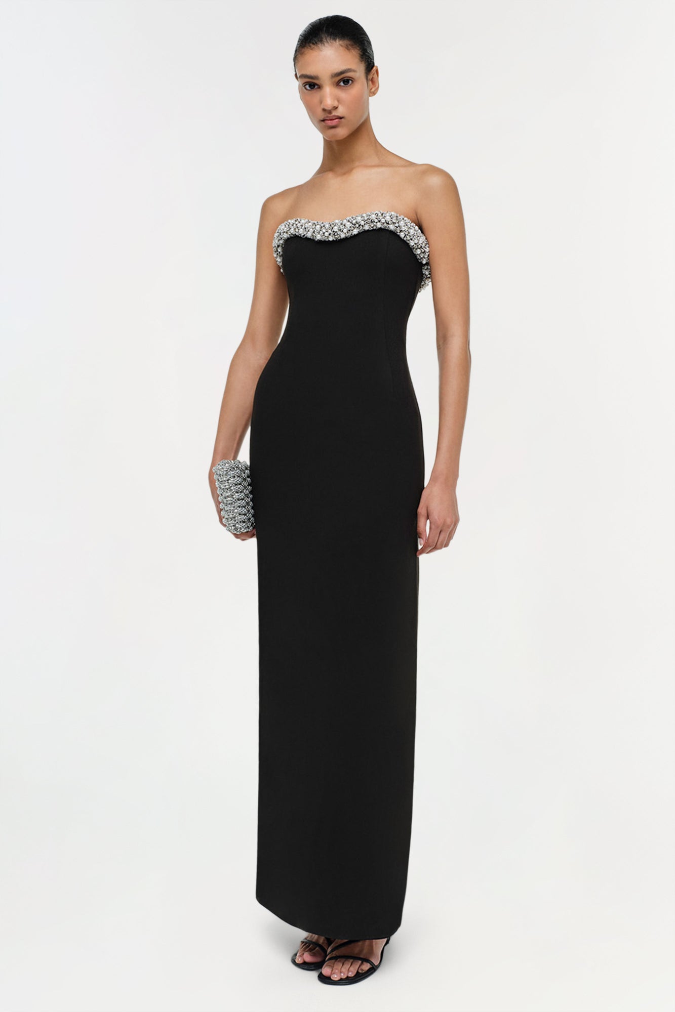 Black strapless floor-length gown with crystal embellishments on neckline and side.