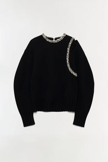 Black pullover with beaded trim around neckline and down right side.