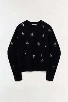 Black ribbed knit crewneck sweater with scattered silver crystal embellishments throughout.