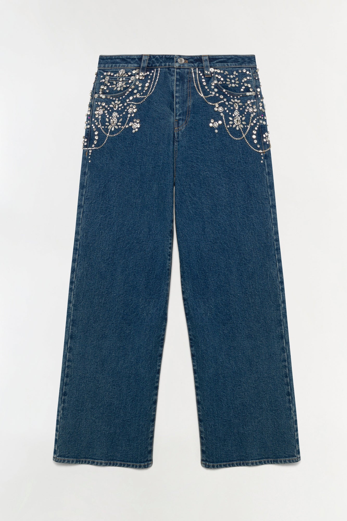 Dark blue crop jeans with pearl and rhinestone embellishments on front pockets and waistband.