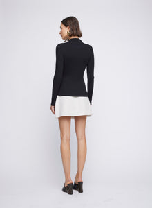 Cotton rib long sleeve polo knit top with contrast trims and mother of pearl buttons. Black knit top, black long sleeve knit top, black work top.