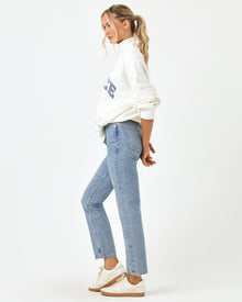 Side profile full-length studio view of the Crush Sweatshirt in cream, a cream quarter-zip pullover sweatshirt with 