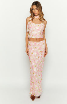 Pink floral print maxi skirt with a fitted silhouette and a subtle flare at the hem