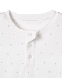 Close-up of a Kids Pima Snug Fit Pajama Short Set in Grey Stars by Petite Plume showcasing a white henley shirt with a round neckline and three-button placket, featuring a subtle grey star pattern, perfect for an effortlessly coordinated sleepwear style.