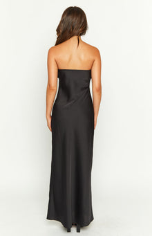 Close-up of the twisted ruched detail on the black satin dress bodice