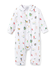 The Baby's Twill Cambridge Romper in 12 Days of Christmas features a white long-sleeve design with a collar, playful festive illustrations, and convenient snap buttons down the front and legs.