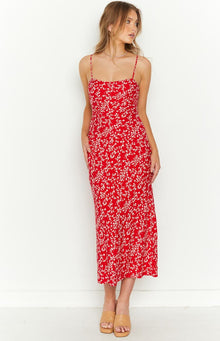 Full length front view of a red floral midi dress with a straight neckline and flowing skirt