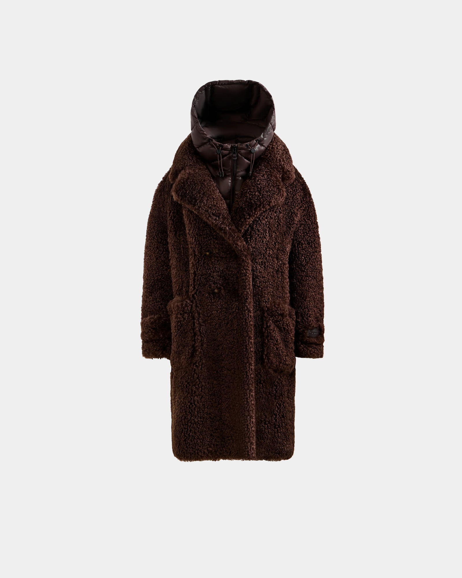 The Rudsak EMRYN - L125588 Espresso is a long, dark brown women’s teddy jacket with large front pockets and a shiny padded collar and hood, shown on a plain light gray background.