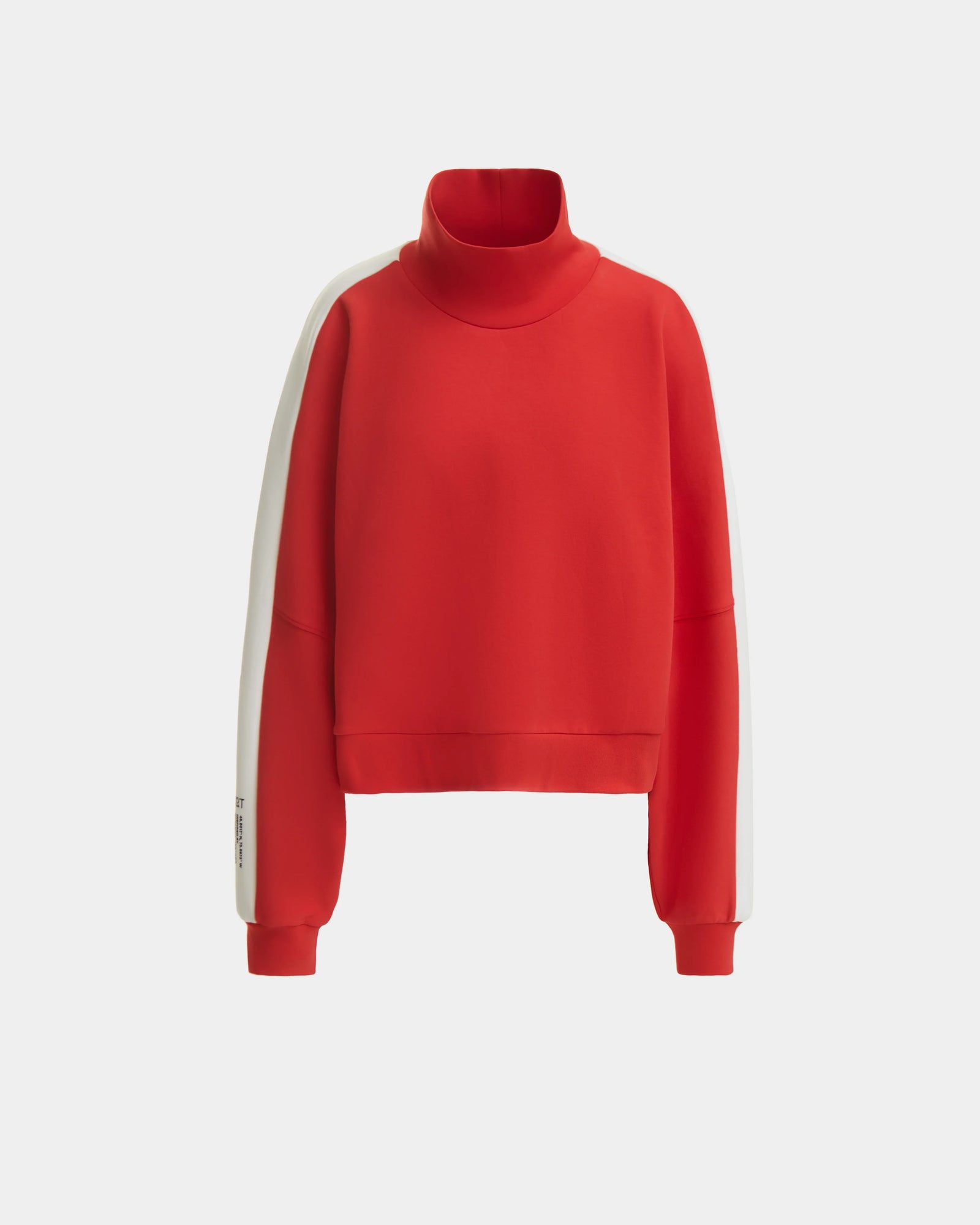 The Rudsak KELLIE - 8524615 Flame Red is a women’s mock neck top with long sleeves, ribbed cuffs, and white arm stripes in a relaxed fit, shown against a plain light background.