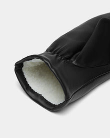 A close-up of Rudsak’s SELMA - 8424508 Black women’s leather mittens, showcasing the white, soft faux shearling lining inside the cuff—a must-have winter essential.