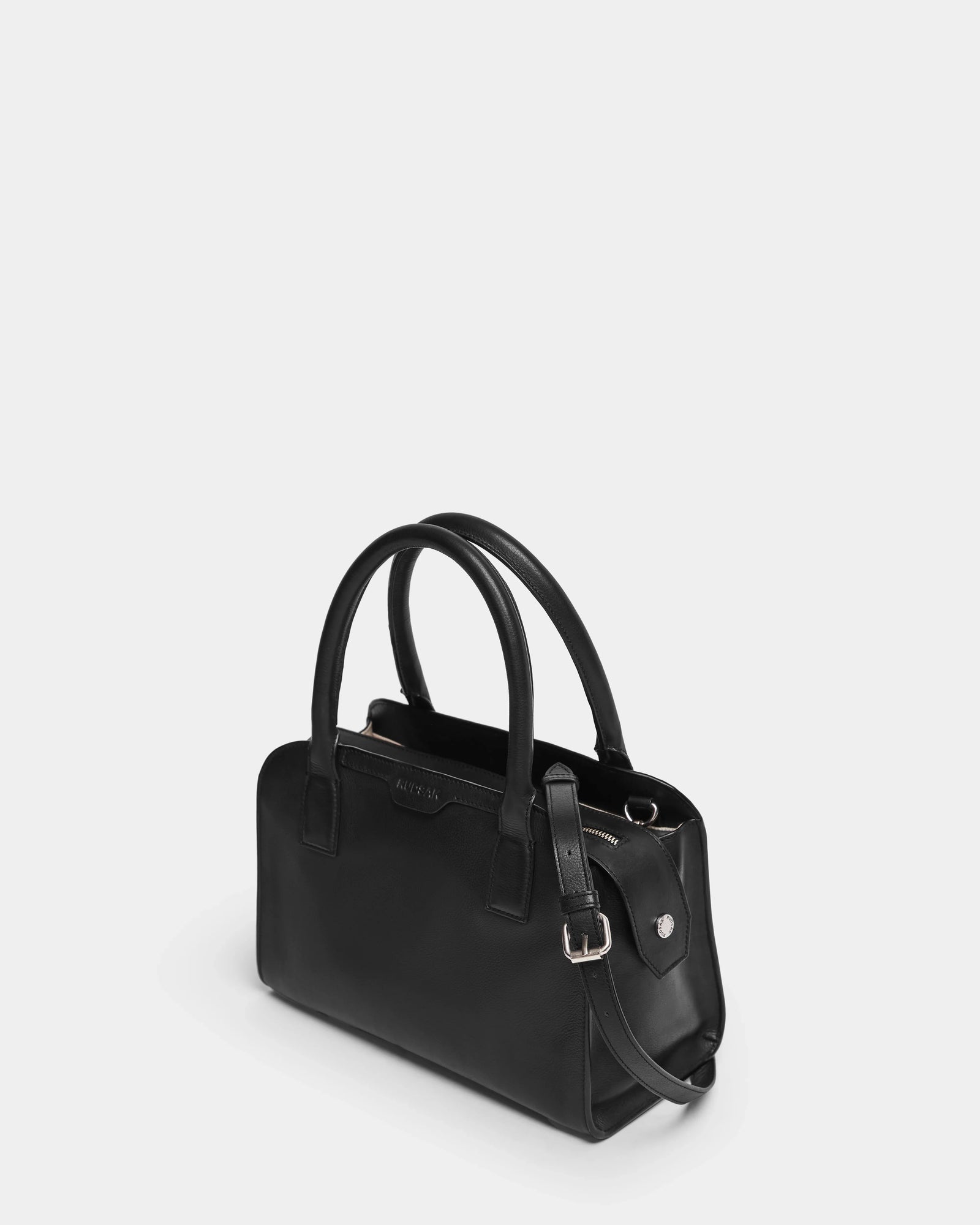 The YASMINA - 8324527 Black by Rudsak is a sleek black womens leather tote bag with a sturdy handle, combining style and functionality for everyday use.