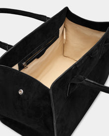 The Rudsak YASMINA L CS - 8324524 Black is a womens large black suede tote featuring a beige interior, zippered pocket, two handles, an open design, spacious unlined compartment, and chic details.