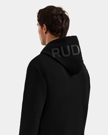 A person with short brown hair faces away, wearing the Rudsak LEROY - U525509 Black M unisex hoodie, featuring 