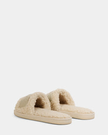 The Rudsak TEDDY - L225517 Vanilla are women’s beige, open-toe faux-shearling slippers with a fluffy texture and cushioned soles, perfect for cozy loungewear, shown against a plain white background.