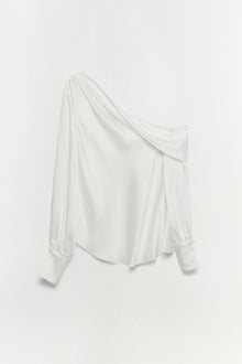 White off-shoulder top with draped neckline and long puffed sleeves.