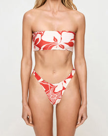 Red and white floral bikini on a plain background