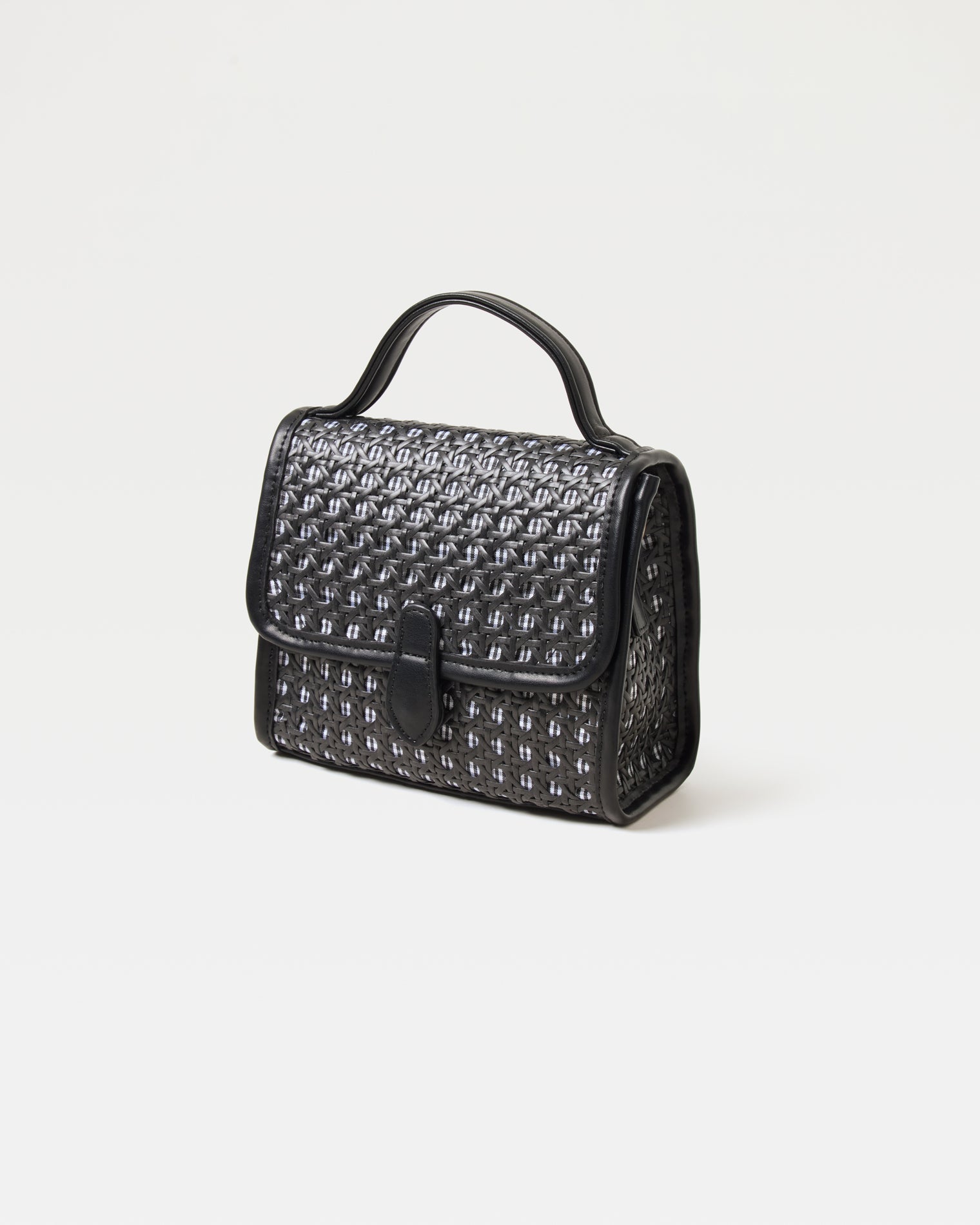 Front view of the Amelia Bag in black showing the woven raffia texture and flap closure.