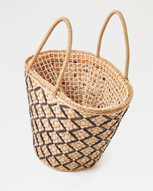 Top-down angled view of the Palma Nights Bag in natural-black showing the open interior, lattice weave pattern, and double rope handles.