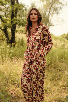 Model is wearing Inez Washable Silk Long PJ Set in Botanical Flower Merlot 