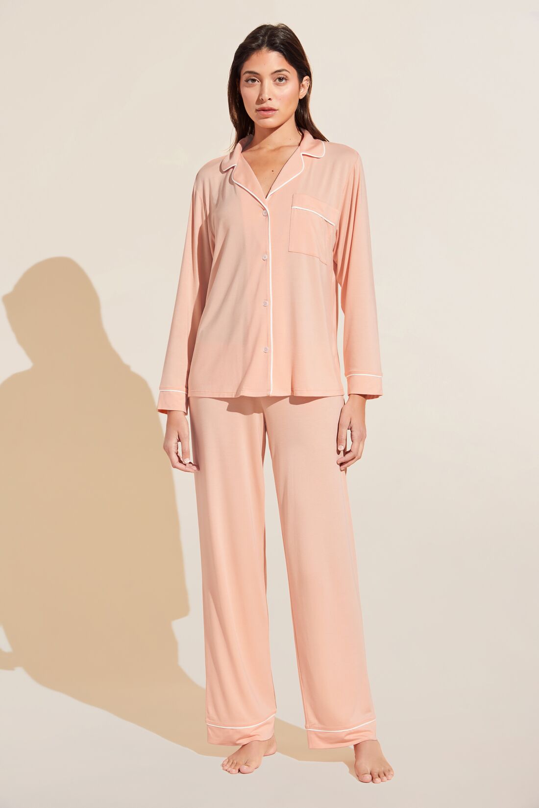 Model is Wearing the Gisele TENCEL Modal Long PJ Set in Peach Parfait/Ivory.