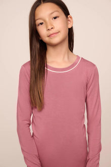 Model is wearing Kids TENCEL Modal Unisex Long PJ Set  in  Berry Blush/Ivory