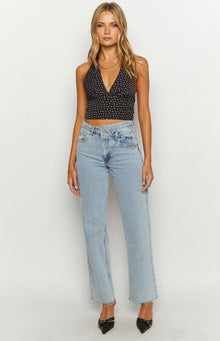 Front view of the black floral print crop top, showing its deep V-neck and halter straps
