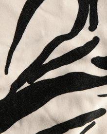 Black abstract leaf pattern on a white background