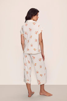 Model is wearing Gisele Printed TENCEL Modal Short Sleeve Cropped PJ Set in  Floral Bloom Ivy/Vanilla Cream