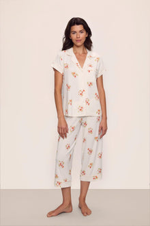 Model is wearing Gisele Printed TENCEL Modal Short Sleeve Cropped PJ Set in  Floral Bloom Ivy/Vanilla Cream