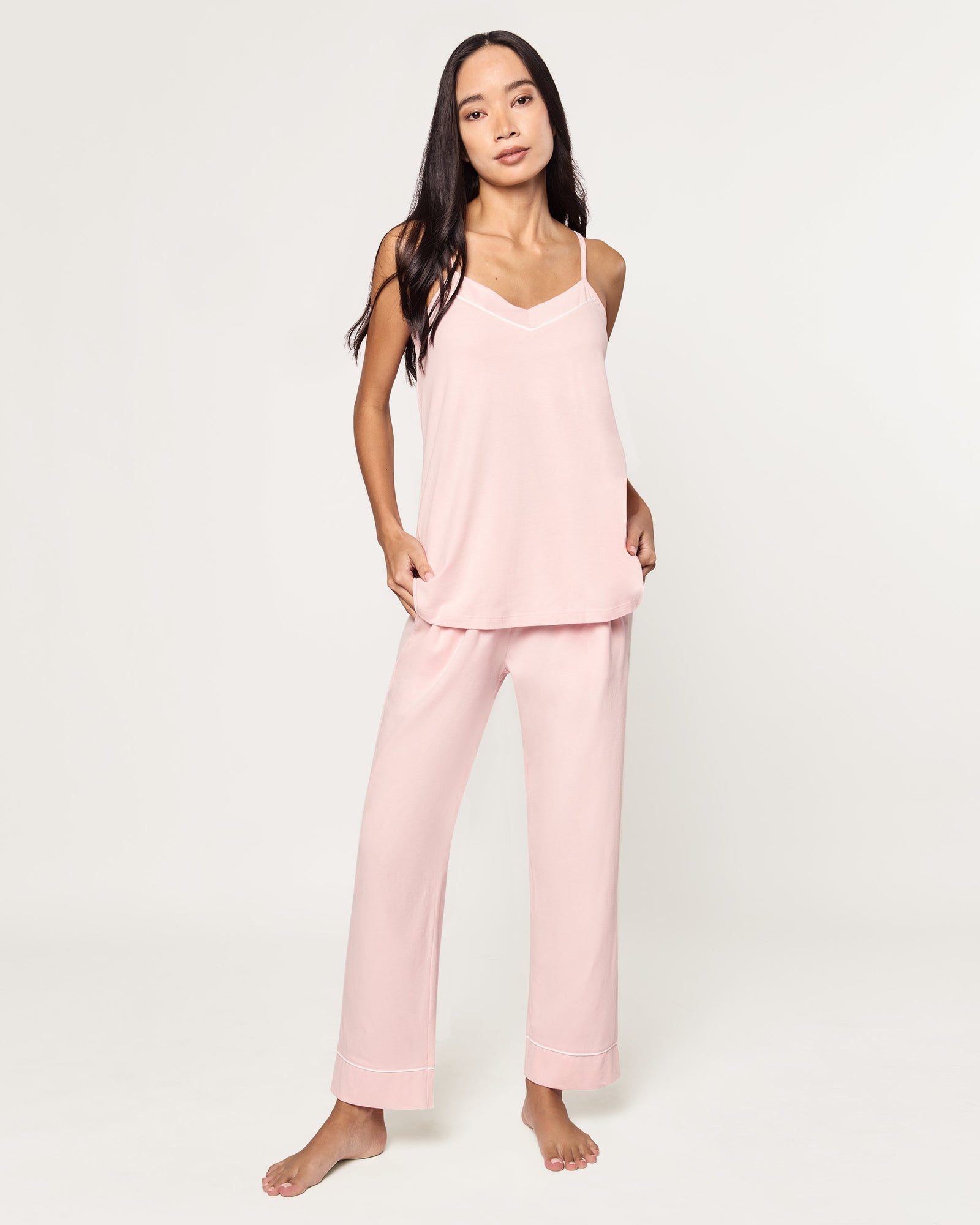The Women's Pima Sylvie Pajama Set in Pink includes a sleeveless V-neck camisole with thin straps and matching elastic-waist pants, both accented with subtle white stitching.
