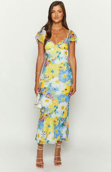 White chiffon maxi dress with a sweetheart neckline, short flutter sleeves, and blue and yellow floral print