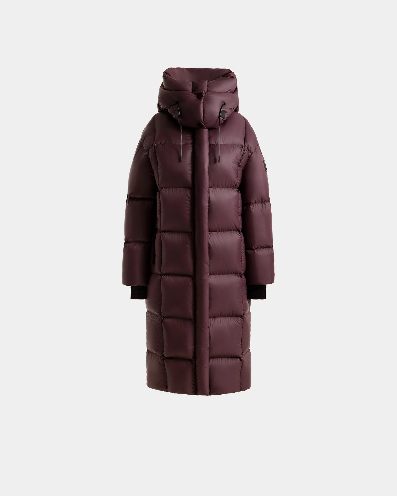 The Rudsak SASHA - 8125686 Bordeaux is a women's maroon quilted long down puffer coat with a hood, black inner cuffs, and RDS-certified down. Shown here against a plain light gray background.