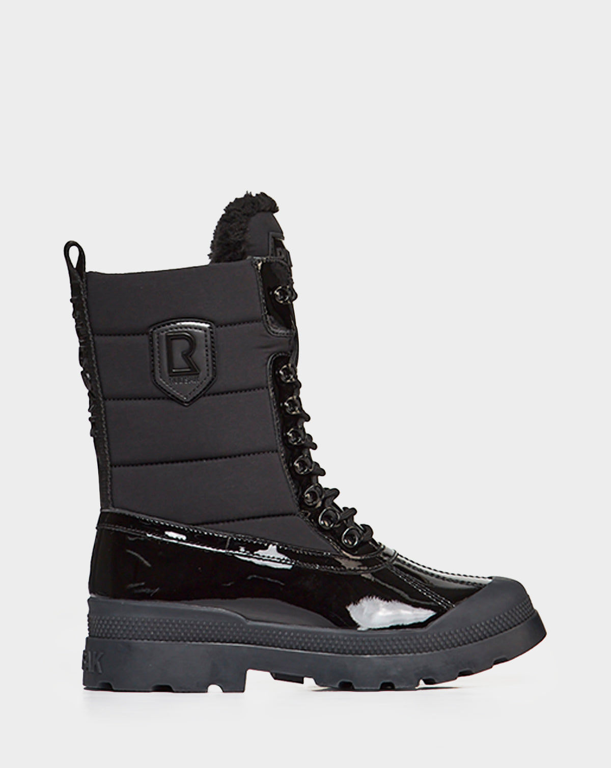 The Rudsak LEX - 8222501 BLACK boot features a rugged sole, lace-up front, shiny patent lower, quilted upper, back pull tab, and side logo patch—waterproof winter boots designed for warmth and style.