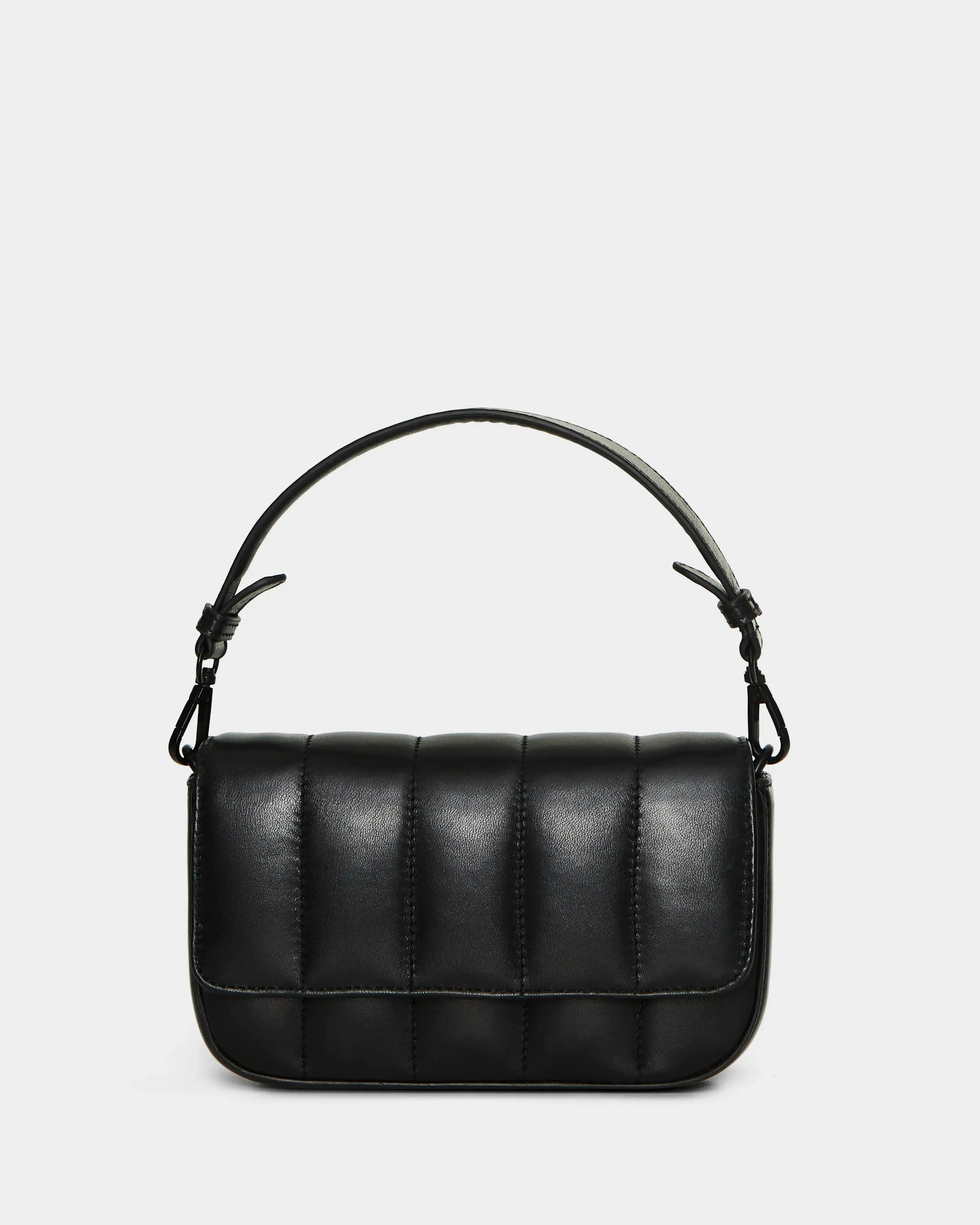 The CHARLI X - 8324009 Black by Rudsak is a small, rectangular quilted leather bag in black with a padded design and short handle, shown on a plain white background—ideal as a chic convertible crossbody for any occasion.