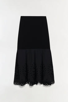 Black knit midi skirt with embroidered cutout detailing along the hem and pleated lower section.