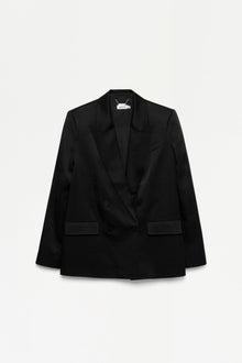 Black double-breasted blazer with notch lapels and flap pockets displayed on neutral background.