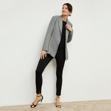 Front image of a woman standing wearing the stella legging in black | Exclude